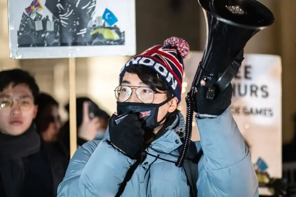 December 10, 2021, London, United Kingdom: Simon Cheng, Hong Kong activist in-exile, speaks through the megaphone during the protest..In celebration of the Human Rights Day (10th Dec), various anti-Chinese Communist Party (anti-CCP) groups in London