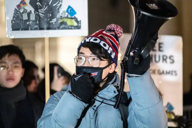 December 10, 2021, London, United Kingdom: Simon Cheng, Hong Kong activist in-exile, speaks through the megaphone during the protest..In celebration of the Human Rights Day (10th Dec), various anti-Chinese Communist Party (anti-CCP) groups in London