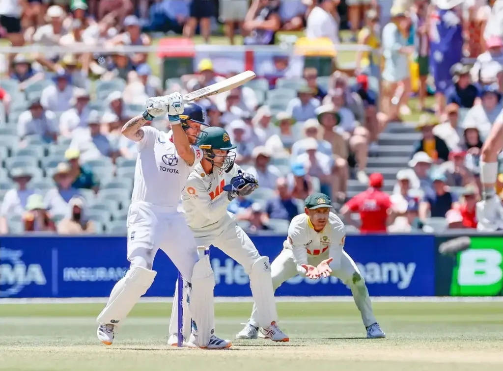 December 18, 2025, Adelaide, South Australia, Australia: BEN STOKES of England dives the ball through cover, as wicket-keeper ALEX CAREY of Australia and 1st slip MARNUS LABUSCHAGNE of Australia watch on, during the 3rd Ashes Test match at Adelaide O