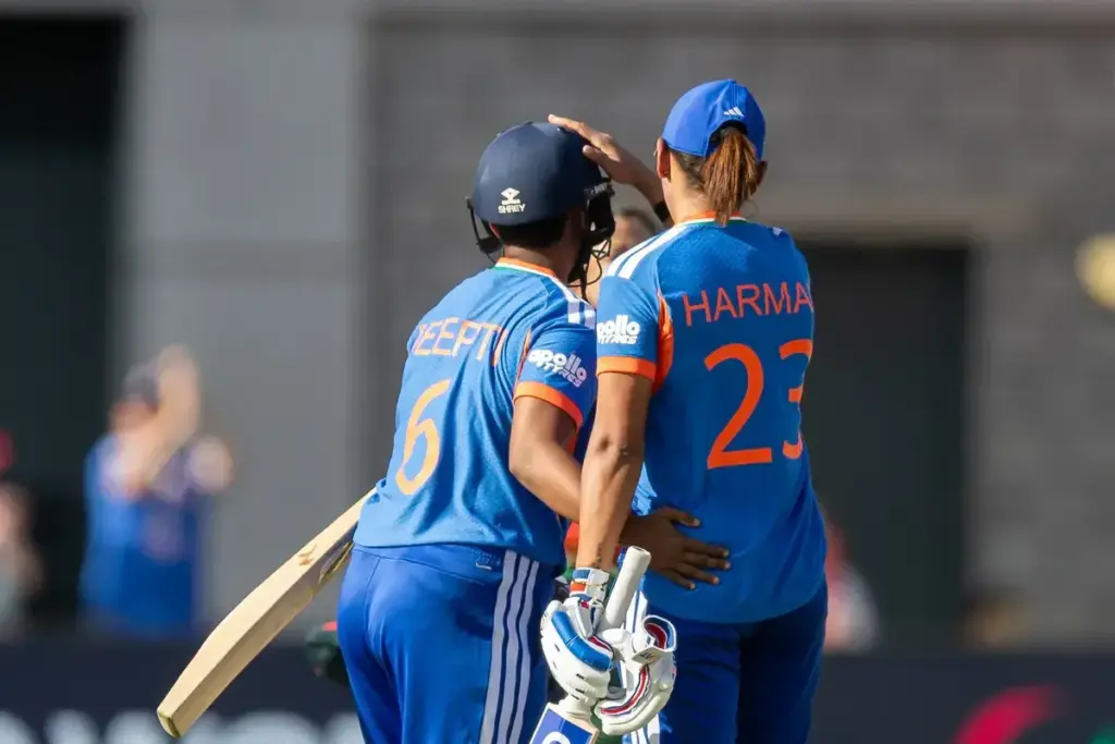 Deepti Sharma hits a SIX for the winning runs and gets pat on the head from India Women Harmanpreet Kaur (c) during the ICC Women's T20 World Cup match between India Women and Bangladesh Women at Old Trafford, Manchester, UK on 25 June 2026.