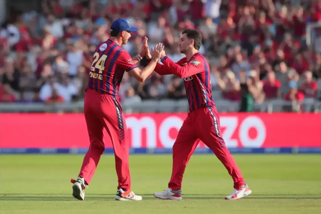 Noor Ahmad of Manchester Super Giants celebrates with Josh Tongue of Manchester Super Giants during the The Hundred match between Manchester Super Giants and Sunrisers at Old Trafford, Manchester, UK on 11 August 2026.
