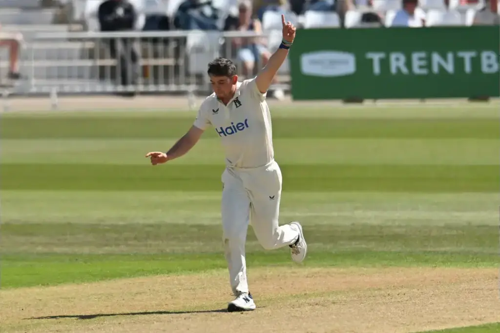 Ethan Bamber of Warwickshire celebrates taking a wicket during the Rothesay County Championship One match between Nottinghamshire County Cricket Club and Warwickshire County Cricket Club at Trent Bridge, Nottingham, UK on 25 April 2026.