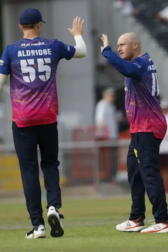 Durhams Kasey Aldridge celebrates a wicket with Durhams Callum Parkinson during the Metro Bank 1 Day Cup match between Lancashire County Cricket Club and Durham County Cricket Club at the Emirates, Old Trafford, Manchester, UK on 14 August 2026.