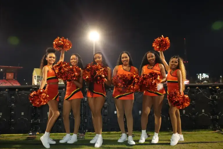 GEORGETOWN GUYANA - JULY 29: Perth Scorchers XI cheerleaders pose for a photo ahead of play during the GSL T20 match between Guyana Amazon Warriors and Perth Scorchers XI at the Guyana National Stadium, Providence, Guyana. (Photo by Ashley Allen/GS